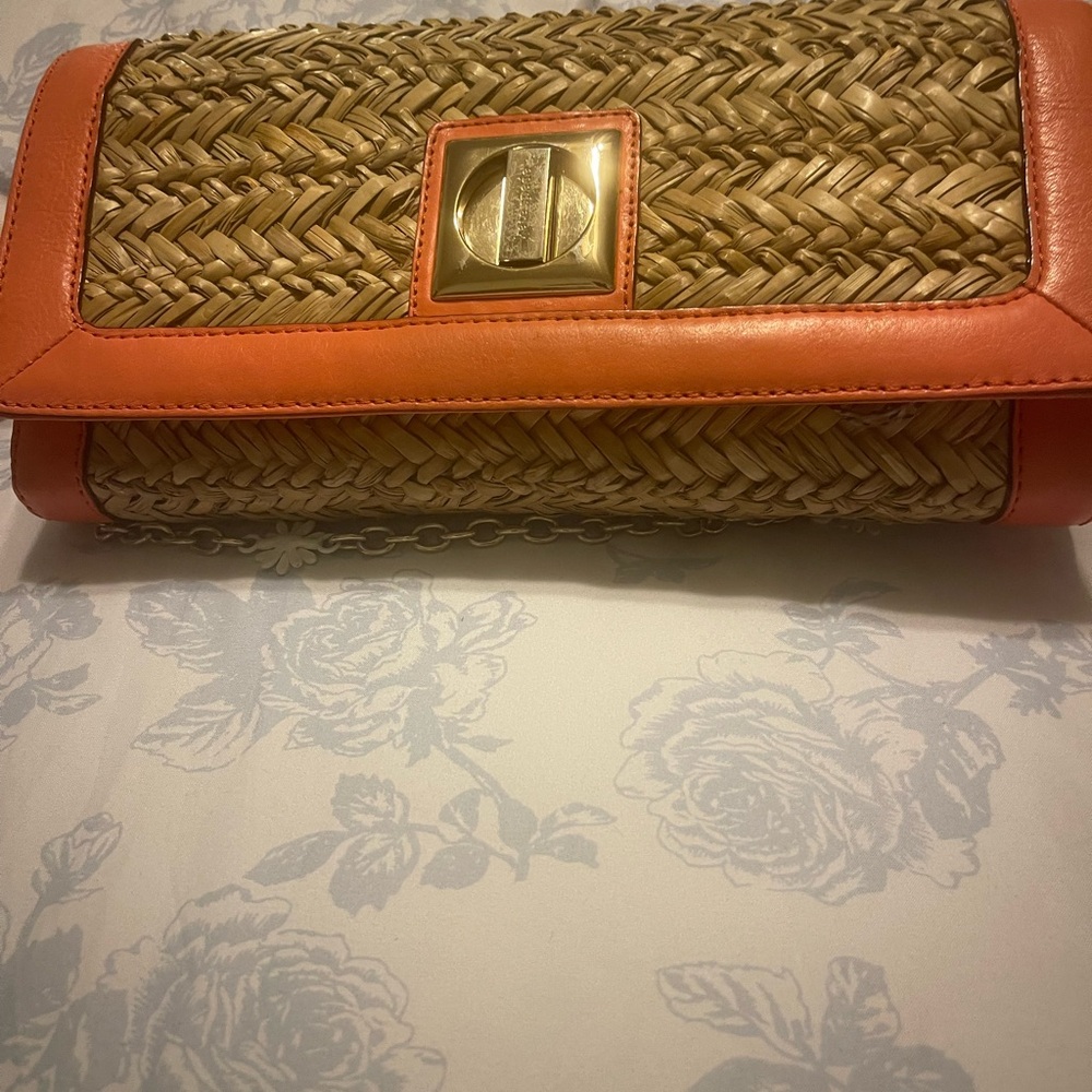 Chic Woven Clutch with Orange Accents
